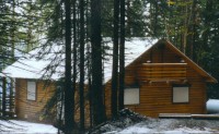 exterior rolling shutters mountain cabin house rental vacation property window treatments Exterior Rolling Shutters photo