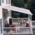 Pinnacle One awning with structure on deck patio