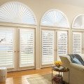 Newstyle composite shutters living room arched windows