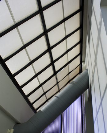 Light colored fixed solar screen skylight shades reflect more heat