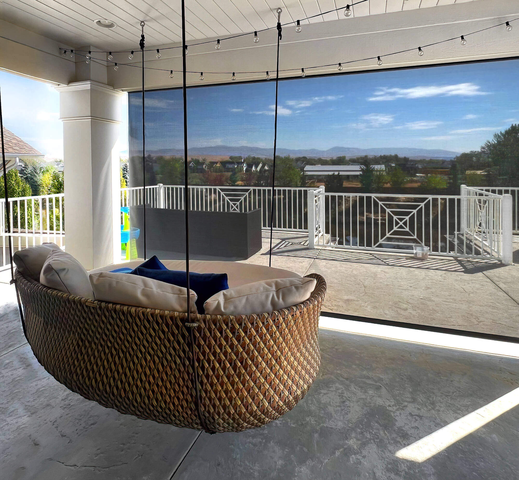 Oasis 2800 Patio Sun Shade on patio with swing