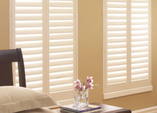 Hunter Douglas Palm Beach Polysatin vinyl shutters warm white