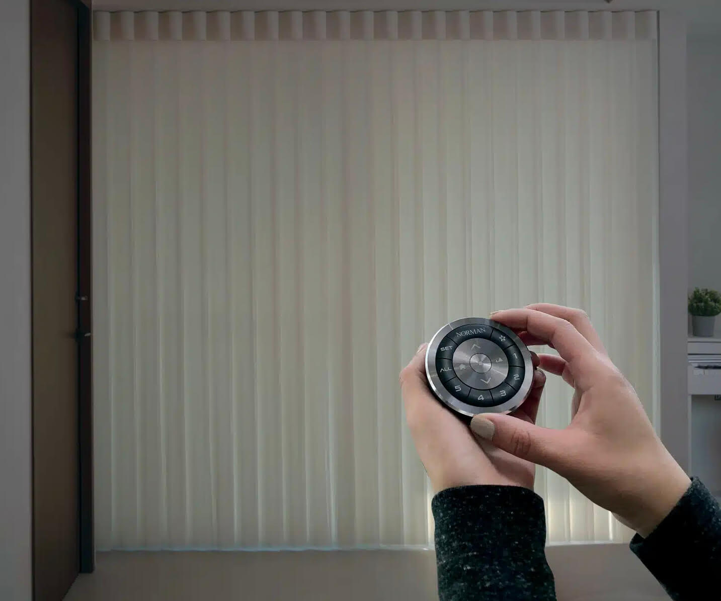 Norman handheld remote control for motorized shades